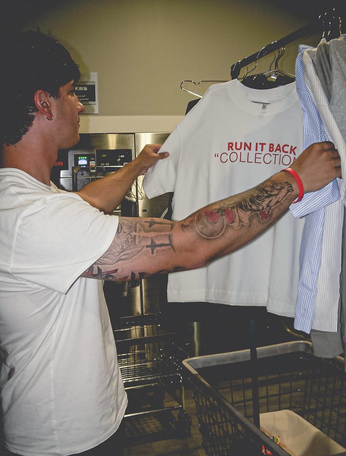 ByDesign Run It Back t-shirt hanging on a rack